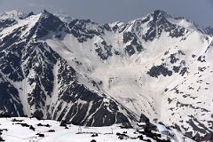 06B Looking Back At Mir Cable Car Station 3500m With Mount Cheget Above From Garabashi 3730m To Start The Mount Elbrus Climb